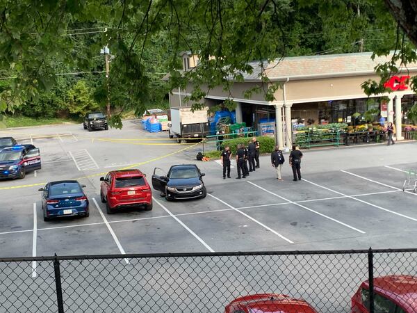 The red Jeep in between the two other cars had its passenger window shattered.