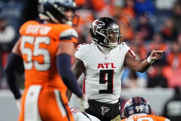 Atlanta Falcons quarterback Michael Penix Jr. (9) works against the Denver Broncos during the second half of an NFL football game, Sunday, Nov. 17, 2024, in Denver. (AP Photo/David Zalubowski)