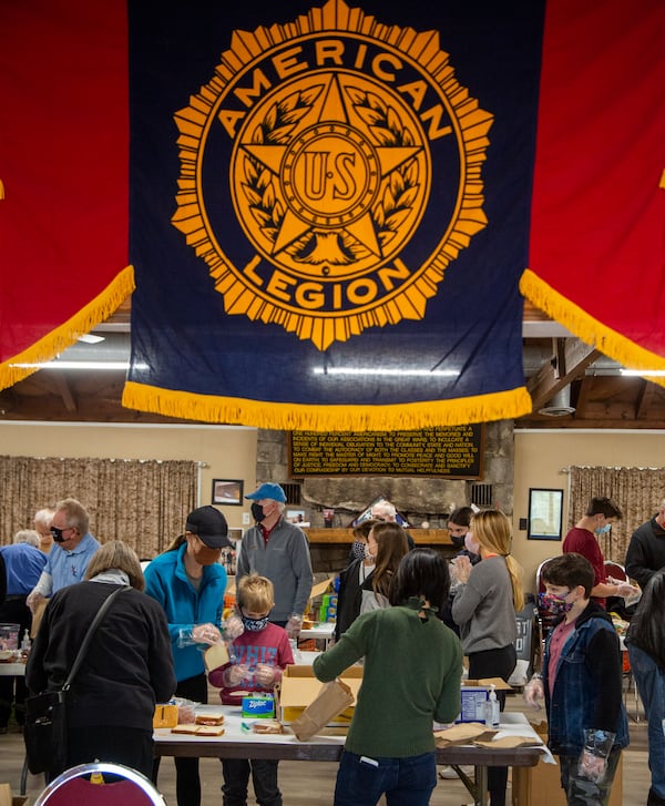 American Legion Post 140 Buckhead members and their family assemble 2,000 lunch bags for USO Operation: Holiday Block Leave. PHIL SKINNER FOR THE ATLANTA JOURNAL-CONSTITUTION.