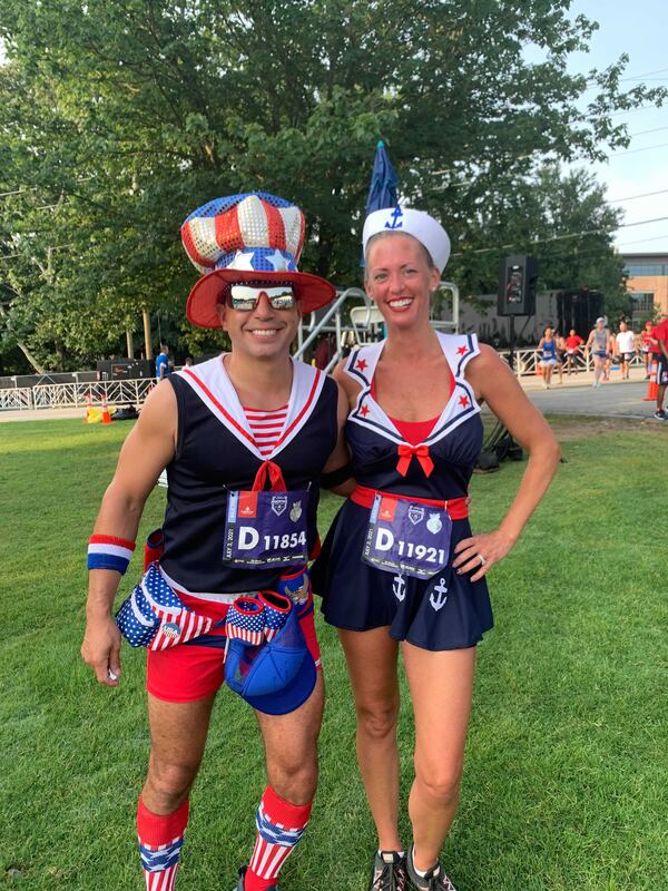 Mark and Megan Vasquez, both 43, sported patriotic outfits for their run. (Photo: Caroline Silva/AJC)