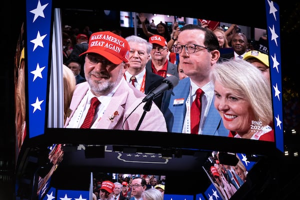 Georgia GOP Chairman Joshua McKoon (blue suit) announces that Georgia delegates back former President Donald Trump during the Republican National Convention in Milwaukee.