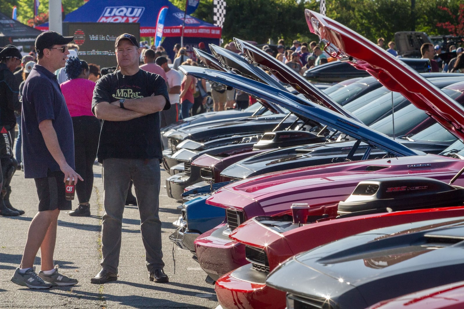 Thomas Godfrey (L) and Michael Seagrave talk while at a recent monthly Caffeine and Octane car show at Perimeter Mall in Dunwoody, GA. STEVE SCHAEFER / SPECIAL TO THE AJC