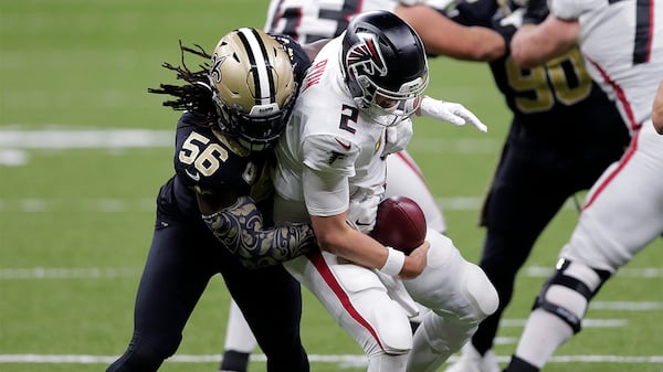 Falcons quarterback Matt Ryan (2) is sacked by Saints outside linebacker Demario Davis (56) in the second half Sunday, Nov. 22, 2020, in New Orleans. (Brett Duke/AP)