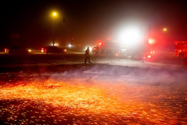 Strong winds carry embers as firefighters work to extinguishe a brush fire in the Winchester community of Riverside County, Calif., on Monday, Jan. 20, 2025. (AP Photo/Noah Berger)