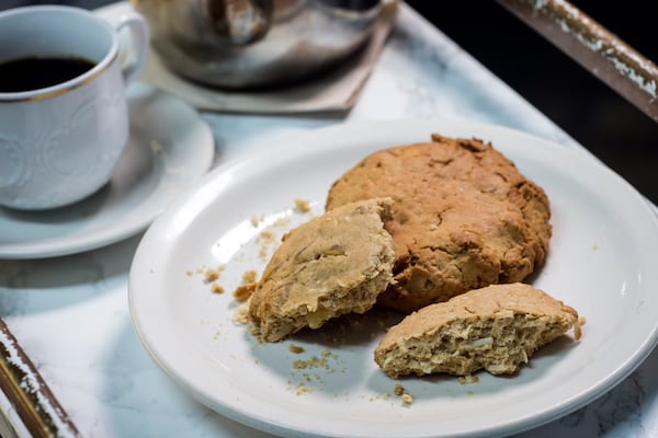 Belinda Baptiste, owner of Unforgettable Bakery and Café, creates items such as Komparét, which features ginger and shredded coconut. (Stephen B. Morton for The Atlanta Journal-Constitution)