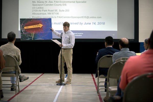 KINGSLAND, GA - APRIL 11, 2018: Camden County resident Kevin Lang, center, holds a graphic showing a model explosion pattern from a FAA study of a Falcon One Rocket during a public hearing to discuss during a public hearing about a potential site for a spaceport in Kingsland, Georgia. (AJC Photo/Stephen B. Morton)