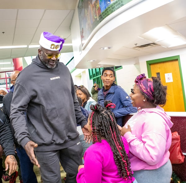 NBA legend Shaquille O’Neal helps host a holiday toy giveaway at Welcome All Park in South Fulton.