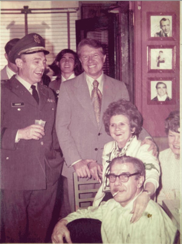 Jimmy Carter is seen with bar owner Luis Chris “Pinkie” Masterpolis (seated front), better known as Pinkie Masters. (Courtesy of the Original Pinkie Masters)