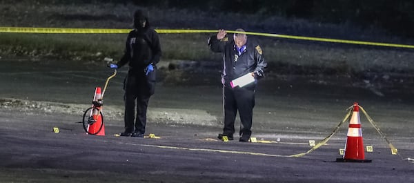 Multiple evidence markers lined the parking lot after a shooting was reported early Tuesday morning.