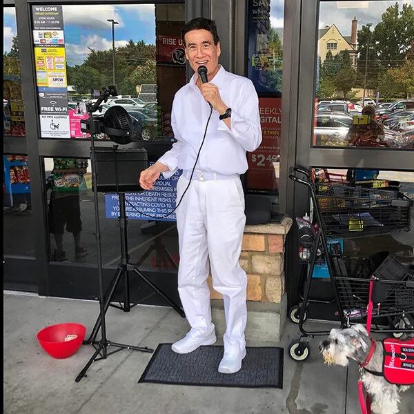 Robert Kim sings outside of the Brookhaven Kroger outside of Cherokee Plaza. (Photo provided by Robert Kim)