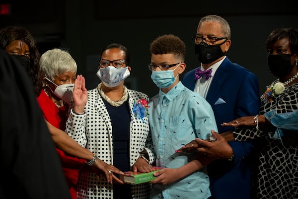 On July 1, 2020, Cheryl Watson-Harris, third from left, was installed as superintendent of the DeKalb County School District. Superintendent, third from left. She was surrounded by family members at the event. From left to right, in relation to Cheryl Watson-Harris, Claudia Houston (aunt), Helen Watson-McDougall (mother), Cheryl Watson-Harris, Luke Alexander (son), Dr. Roger Harris (husband), Michelle Houston (cousin). On April 26, 2022, Watson-Harris was fired by the school board. (REBECCA WRIGHT FOR THE ATLANTA JOURNAL-CONSTITUTION)