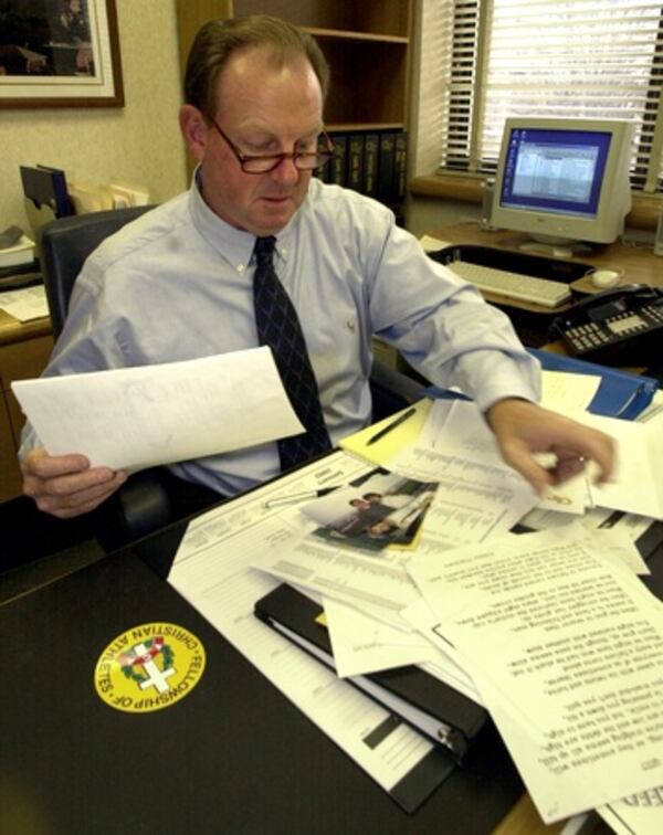 020116 - ATLANTA, GA.: Georgia Tech head football coach Chan Gailey gets comfortable in his new office on campus Wednesday, 1/16/02. Gailey just finished his last season as offensive coordinator of the Miami Dolphins and moved in at Tech. (PHOTO BY KIM SMITH/STAFF) Chan Gailey at Georgia Tech. (AJC file photo)