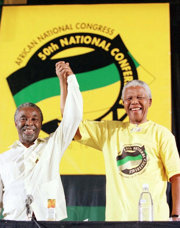  Nelson Mandela poses in patriotic colors with President Thabo Mbeki. The African National Congress was outlawed under apartheid rule.