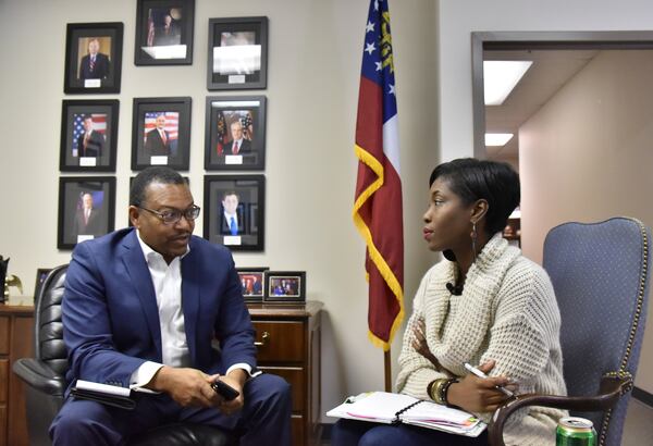 Leo Smith, the Minority Engagement Director for the Georgia Republican Party, talks to Janelle Jones during a meeting with Georgia Black Republican Council at Georgia Republican Party Headquarters in Buckhead on Tuesday, December 20, 2016. HYOSUB SHIN / HSHIN@AJC.COM