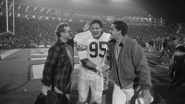 Georgia defensive tackle Bill Goldberg celebrates with fans. AJC file photo