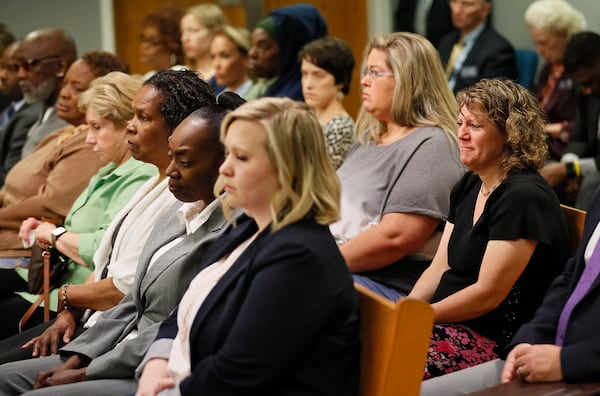 A crowded gallery that includes family members and Emani Moss's fourth grade teacher listen to final arguments from the prosecution during the Tiffany Moss murder trial on April 29, 2019.