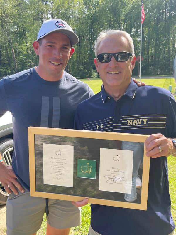 PGA Tour golf Scott Stallings (left) presents Atlanta realtor Scott Stallings (right) with his invitation to the Masters after the coveted piece of mail was mis-directed.