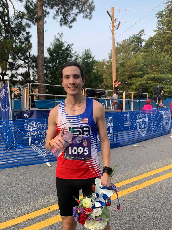 The first runner to finish the race on Saturday, July 3, 2021: Aberto Mena. (Photo: Caroline Silva/AJC)