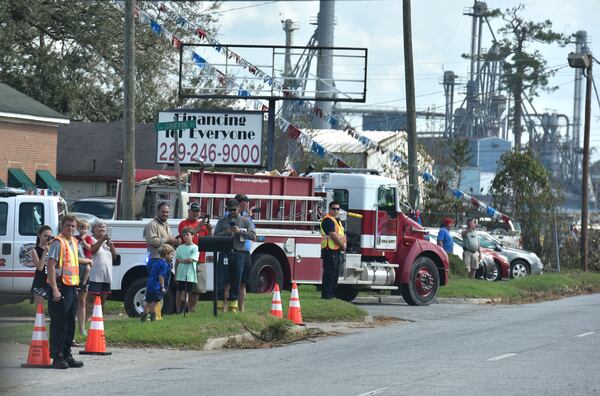 October 16, 2018 Bainbridge - Spectators line up as the Vice President motorcade processes in Bainbridge on Tuesday, October 16, 2018. Vice President Mike Pence touched down in this Southwest Georgia city Tuesday and addressed the Sunbelt Agricultural Exposition in Moultrie as he surveyed storm damage from Hurricane Michael. Penceâs visit comes a day after President Donald Trump and First Lady Melania Trump traveled through the central part of the Peach State and met with farmers. HYOSUB SHIN / HSHIN@AJC.COM