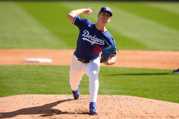 Los Angeles Dodgers pitcher Bobby Miller throws during the third inning of a spring training baseball game against the Chicago Cubs, Thursday, Feb. 20, 2025, in Phoenix. (AP Photo/Ashley Landis)