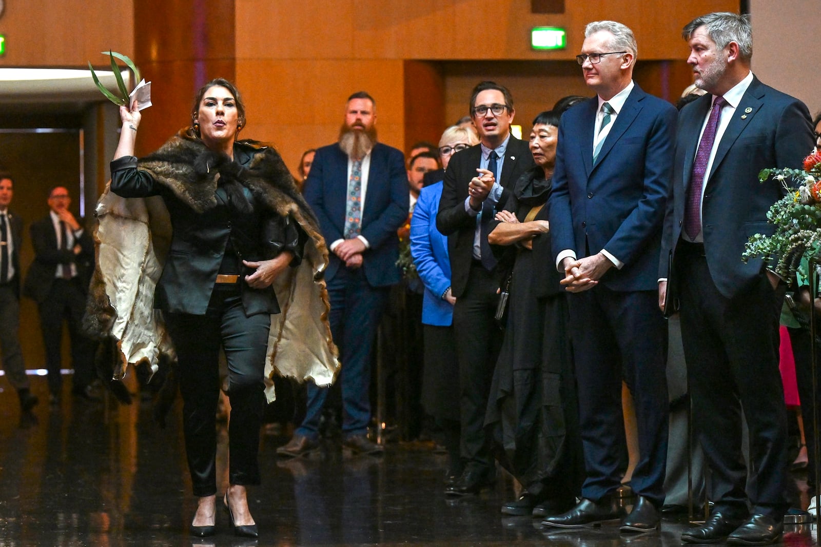 Australian Senator Lidia Thorpe, left, disrupts proceedings as Britain's King Charles and Queen Camilla attend a Parliamentary reception hosted by Australian Prime Minister Anthony Albanese and partner Jodie Jaydon at Parliament House in Canberra, Australia, Monday, Oct. 21, 2024. (Lukas Coch/Pool Photo via AP)