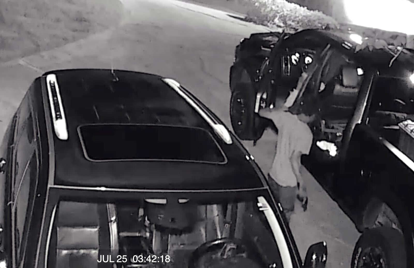 Surveillance footage from a Cherokee County home shows a man stealing a handgun from a pickup truck overnight. 