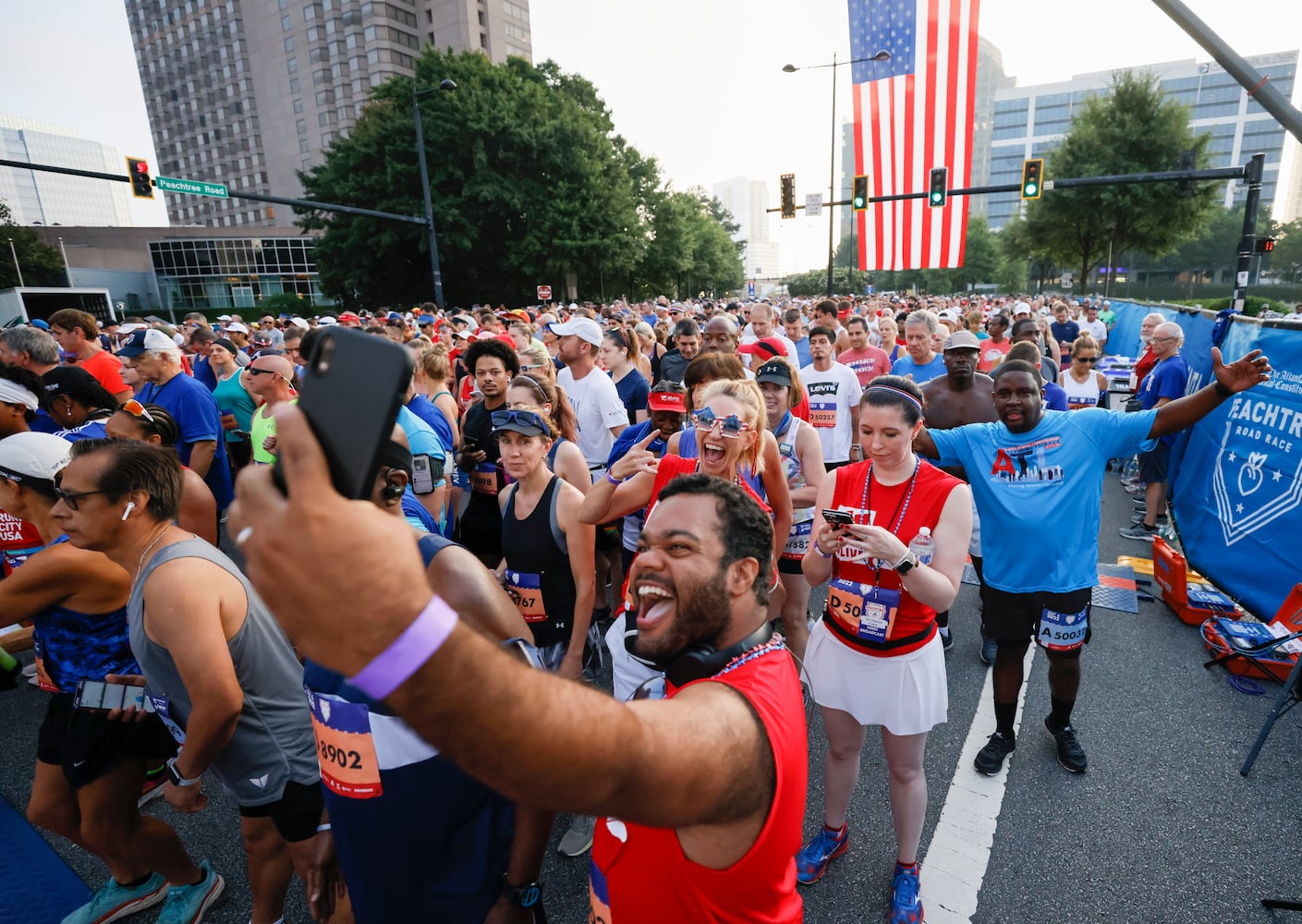 Runners prepare for the 53rd running of the Atlanta Journal-Constitution Peachtree Road Race in Atlanta on Sunday, July 3, 2022. (Miguel Martinez / Miguel.Martinezjimenez@ajc.com)