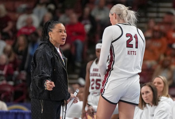 South Carolina head coach Dawn Staley talks with forward Chloe Kitts (21) during an NCAA college basketball game against Vanderbilt in the quarterfinals of the Southeastern Conference tournament, Friday, March 7, 2025, in Greenville, S.C. (AP Photo/David Yeazell)