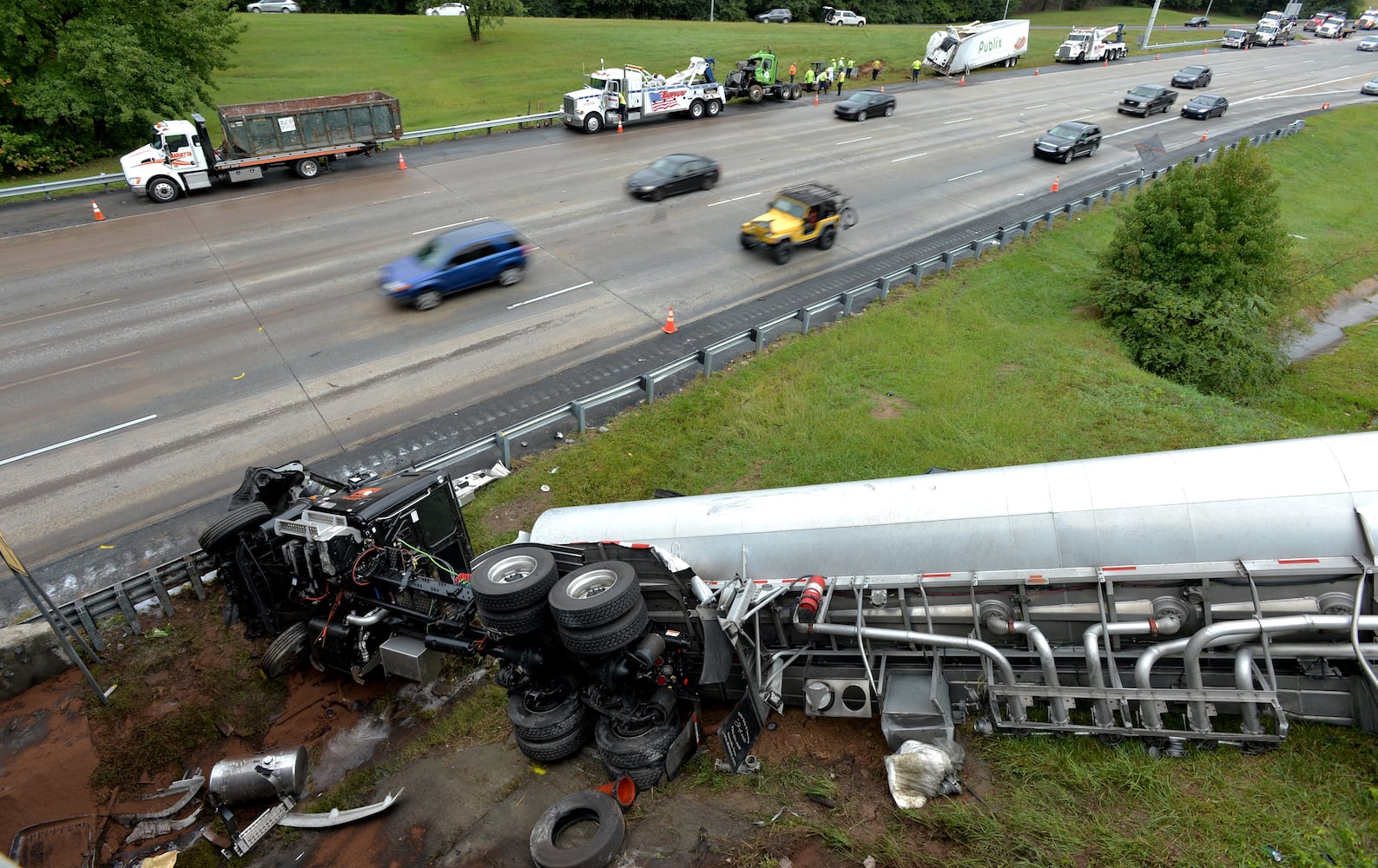 I-285 crash: Trucks plunge off interstate onto Ga. 400