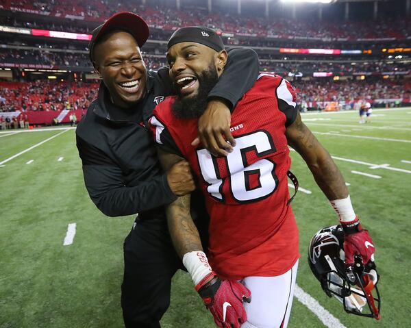  FILE: January 14, 2017, Atlanta: Falcons wide recievers coach Raheem Morris and wide receiver Justin Hardy celebrate a 36-20 victory over the Seahawks in a NFL football NFC divisional playoff game on Saturday, Jan. 14, 2017, in Atlanta. Curtis Compton/ccompton@ajc.com