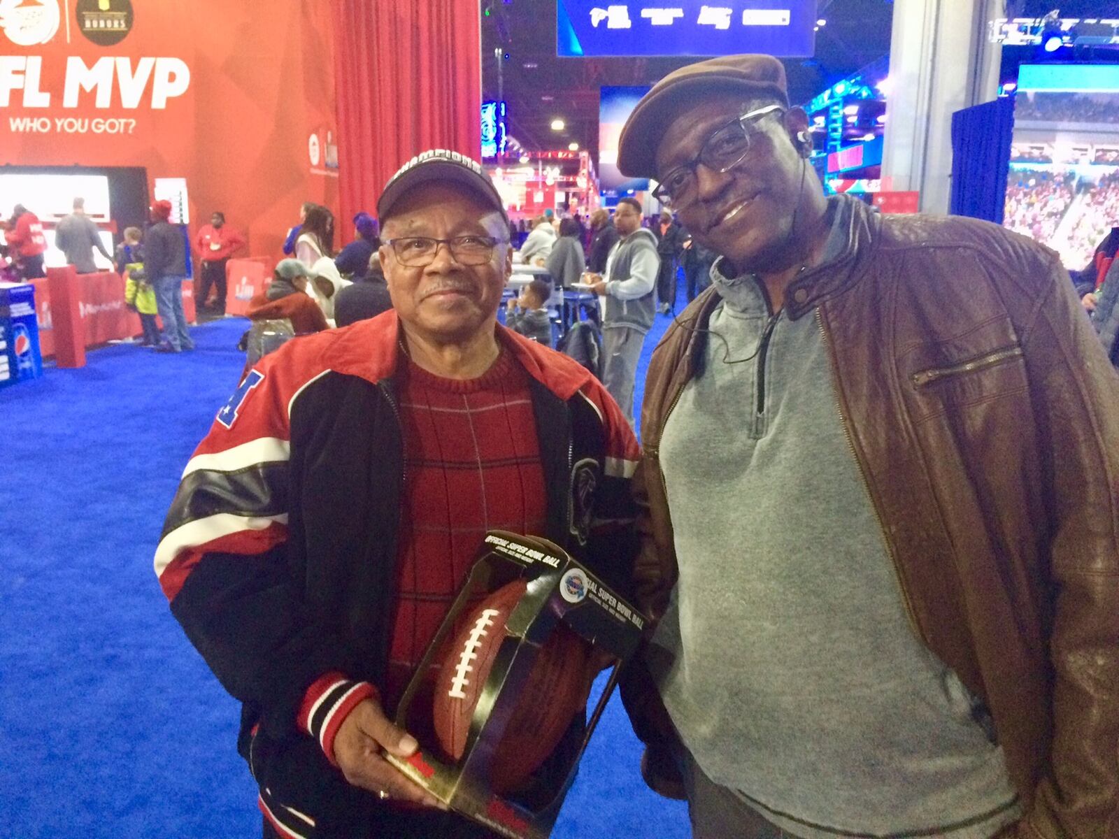 Edward Foxworth (left) and his brother Victor, both “Grady babies,” attended the Super Bowl Experience in downtown Atlanta to capture a bit of the big game’s feel and bask in civic pride. 