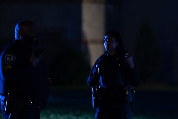 Emory police stand on the quad after clearing protesters. Police cleared the quad Saturday night after someone began spray painting the convocation center.Protesters gather for the third day on the Emory University quad. Saturday, April 27 , 2024 (Ben Hendren for the Atlanta Journal Constituion)