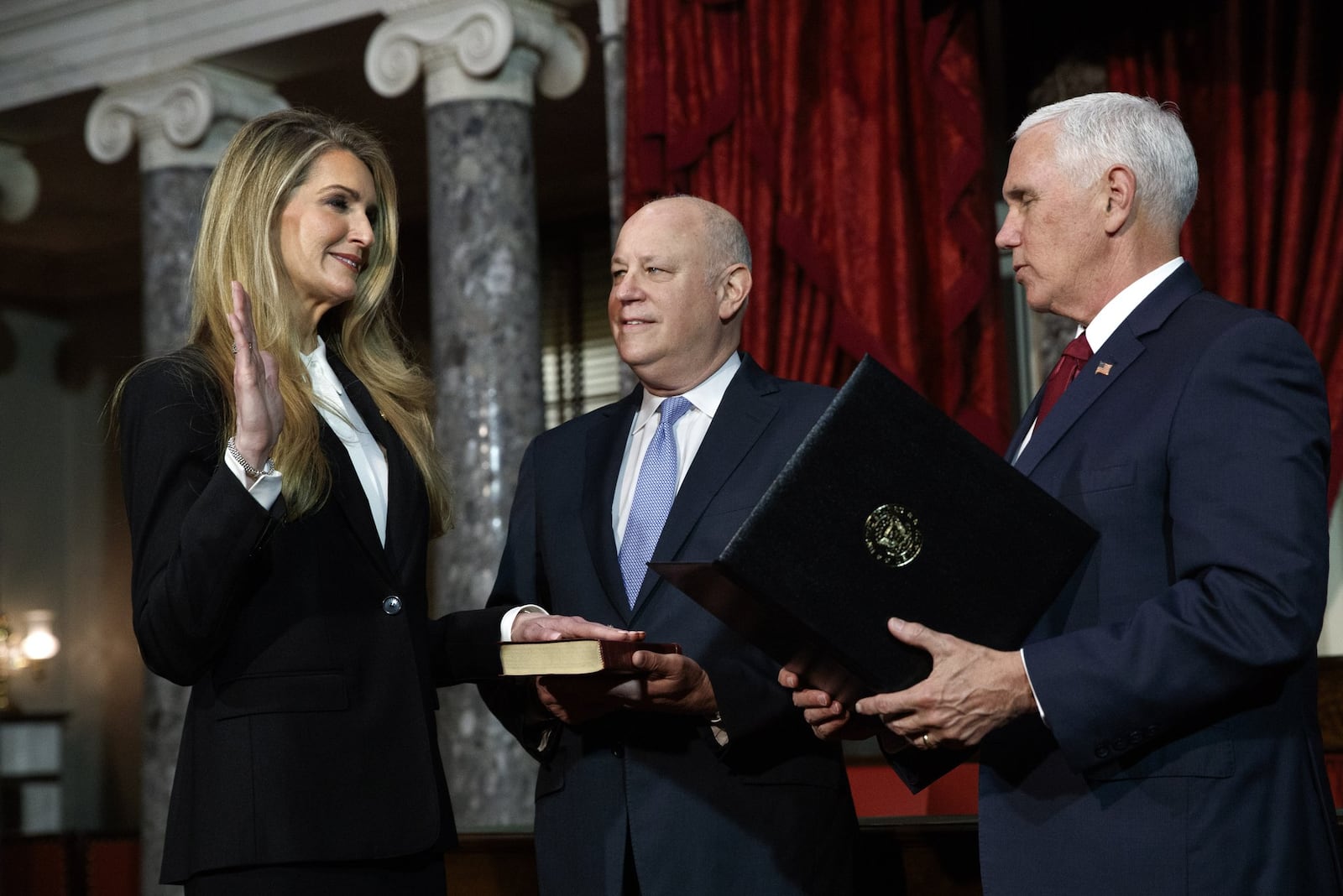 U.S. Sen. Kelly Loeffler and her husband, Intercontinental Exchange Chief Executive Jeff Sprecher, center, have loaned or given $31 million this year to support Republicans in and out of Georgia in this year's election. (AP Photo/Jacquelyn Martin)