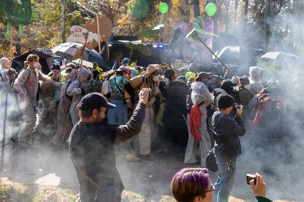 Hundreds of demonstrators who oppose the Atlanta Public Safety Center marched last month to the construction site in DeKalb County, where they clashed with authorities who fired tear gas to break up the protest. (Arvin Temkar / arvin.temkar@ajc.com)