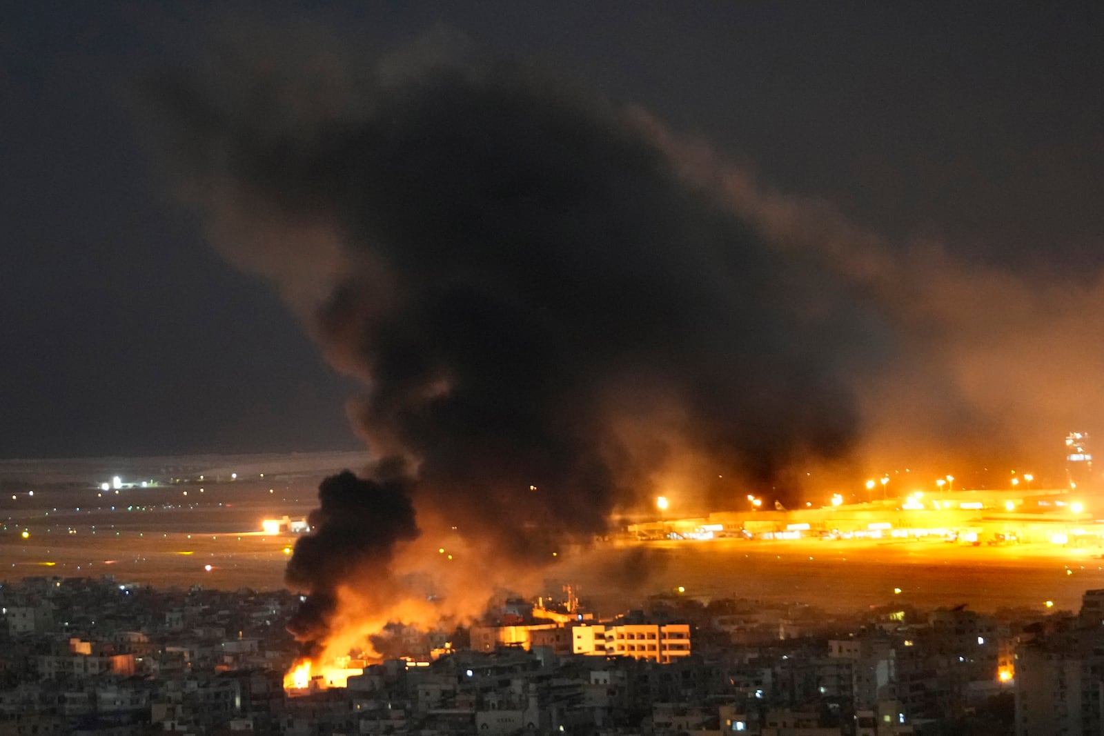 Flames and smoke rise form an Israeli airstrike on Dahiyeh, in the southern suburb of Beirut, Lebanon, Sunday, Oct. 20, 2024. (AP Photo/Hussein Malla)