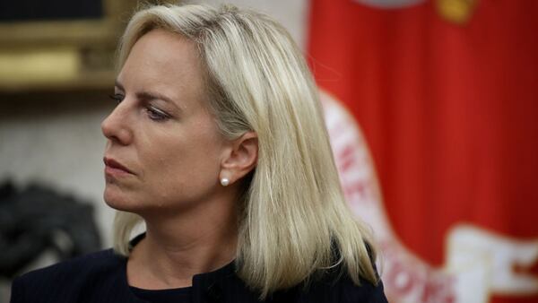 Homeland Security Secretary Kirstjen Nielsen listens as U.S. President Donald Trump speaks during a meeting with FEMA Administrator Brock Longin the Oval Office September 11, 2018 in Washington, DC.