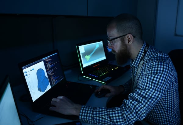 Jeffrey Lynch, a forensic anthropologist, develops 3-D models of skeletal remains inside the Defense POW/MIA Accounting Agency Offutt Laboratory Dec. 12, 2019 at Offutt AFB, Nebraska. (U.S. Air Force Photo by Charles Haymond)