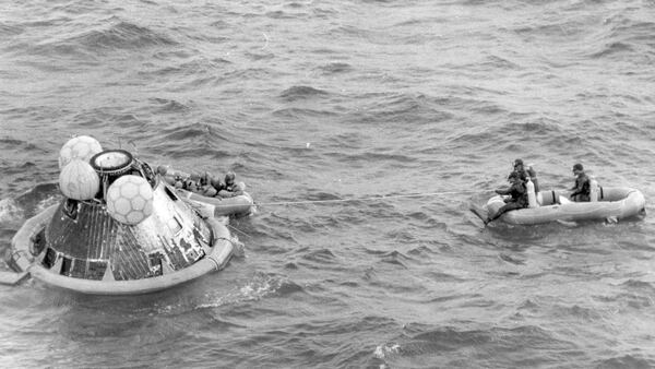 In this July 24, 1969 file photo, the Apollo 11 command module lands in the Pacific Ocean and the crew waits to be picked up by U.S. Navy personnel after an eight day mission to the moon. The Apollo 11 command module, which travelled more than 950,000 miles to take Americans to the moon and back in 1969, is going on a road trip, leaving the Smithsonian for the first time in more than four decades. (AP Photo, File)