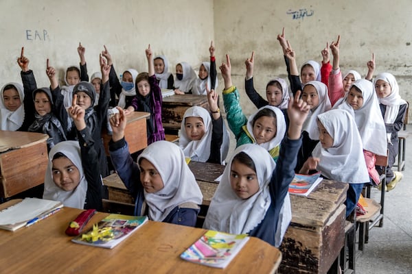 FILE -FILE - Afghan school girls attend their classroom on the first day of the new school year, in Kabul, Saturday, March 25, 2023. (AP Photo/Ebrahim Noroozi, File, File)