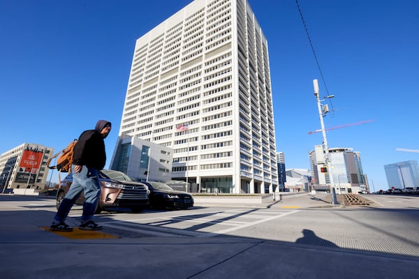 A pedestrian walks in front of the Richard B. Russell Building in downtown Atlanta on Feb. 24, 2025. This day marked the first full return-to-office day for numerous federal workers in downtown Atlanta. Miguel Martinez/AJC