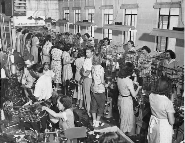 Textiles played an outsized role in Georgia’s economic development from Antebellum years to the 1950s, when one of every three of the state’s industrial workers were linked to the industry. Here, the owner of the busy Helen Hosiery Mills plant watches over the operation sometime in the 1950s. The factory sold argyle hose all over the world. (AJC Archive at GSU Library AJCP315-044l)