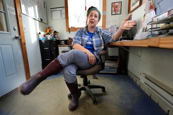 Seafood dealer Rogue Brawn speaks to a reporter at a processing facility, Tuesday, March 11, 2025, in Bremen, Maine. (AP Photo/Robert F. Bukaty)