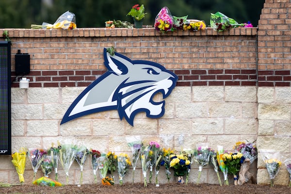 Flowers were placed in a memorial at Apalachee High School after four people were killed in a shooting.