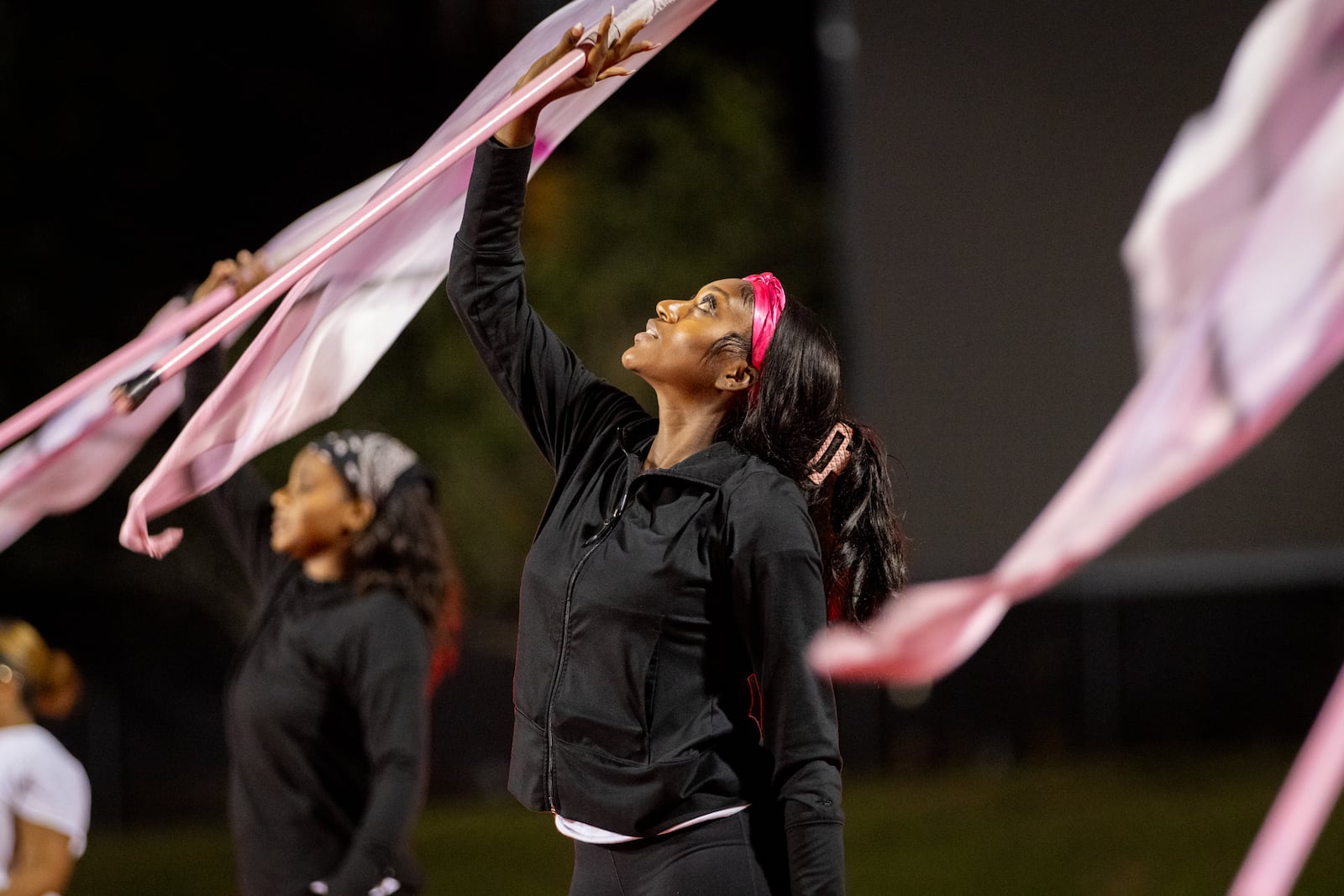 Flag bearer Courtney Ward practices with the Clark Atlanta University marching band at Panther Stadium. Until this year, the sophomore from Savannah had never been in a marching band. She never twirled a flag, but tried out for the flag team and now often stands out front during many routines.
“I found out that I was kind of good at it,” Ward said. “It’s a lot of work that I have to put in, but it is worth it because I enjoy being on the field. I enjoy the crowd cheering for me.” (Arvin Temkar / AJC)