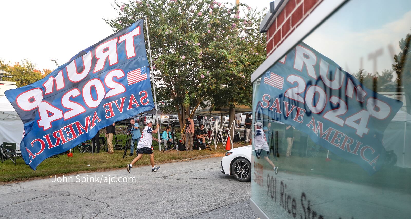 Groups of Trump supporters wait outside the Fulton County Jail on Thursday ahead of the former president's surrender. (John Spink / John.Spink@ajc.com )