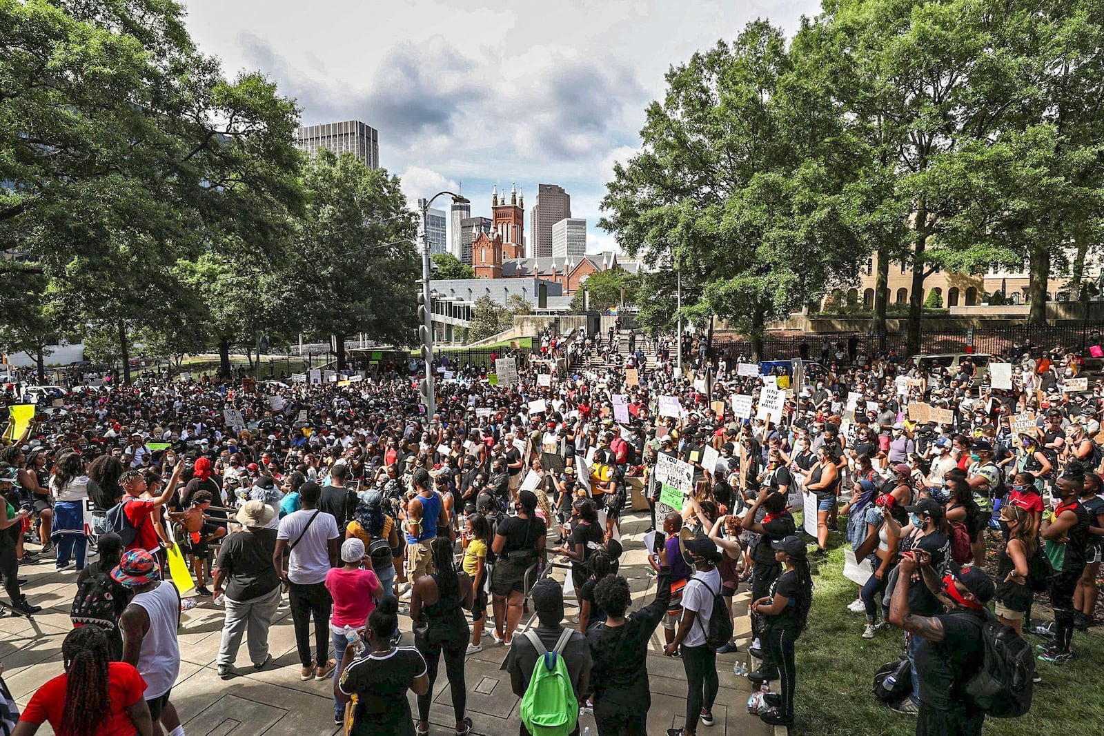 undreds gathered outside of Atlanta City Hall Sunday following a march from Cleopas R. Johnson Park. (Photo: Alyssa Pointer / AJC)