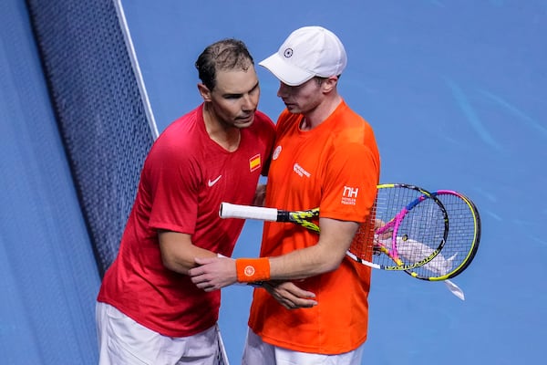 Spain's tennis player Rafael Nadal embraces after losing against Netherlands' Botic Van De Zandschulp during a Davis Cup quarterfinal match at Martin Carpena Sports Hall in Malaga, southern Spain, on Tuesday, Nov. 19, 2024. (AP Photo/Manu Fernandez)