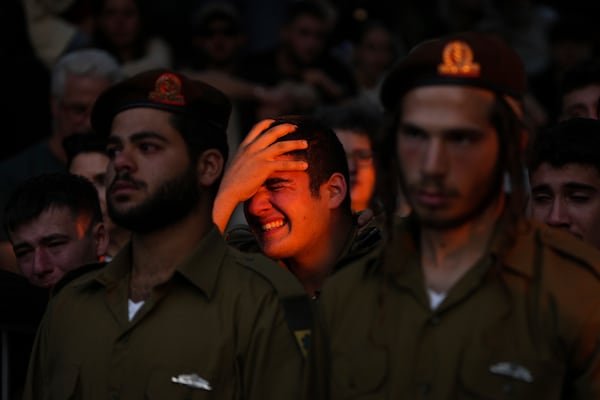 Mourners react during eulogies for Israeli soldier Capt. Itay Marcovich, who was killed in action in Lebanon, during his funeral in Kokhav Yair, Israel, Thursday, Nov. 14, 2024. (AP Photo/Ohad Zwigenberg)