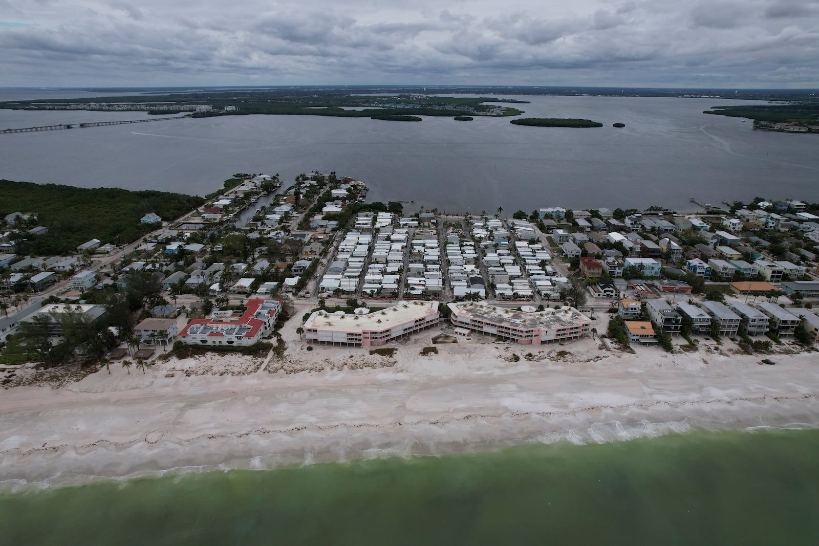 A stretch of Bradenton Beach, Fla, that is still recovering from flooding and damage from Hurricane Helene is seen ahead of the arrival of Hurricane Milton on Anna Maria Island on Tuesday. (AP Photo/Rebecca Blackwell)