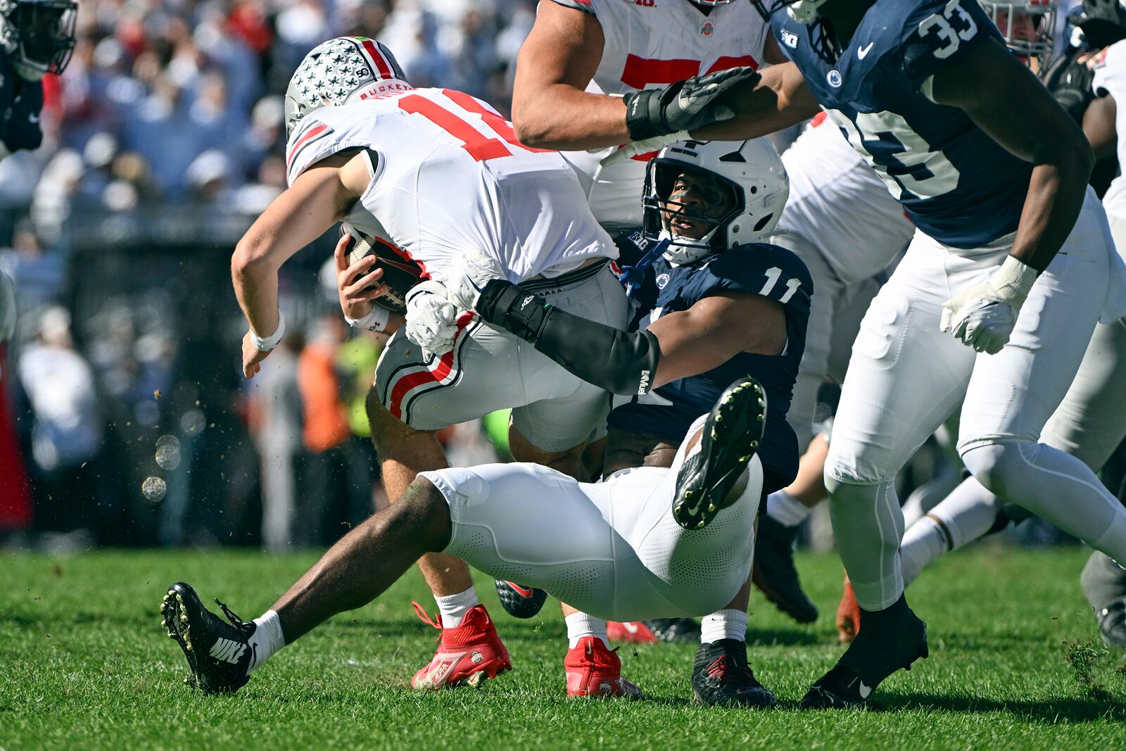 Penn State defensive end Abdul Carter (11) sacks Ohio State quarterback Will Howard (18) during the second quarter of an NCAA college football game, Saturday, Nov. 2, 2024, in State College, Pa. (AP Photo/Barry Reeger)